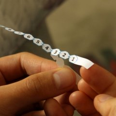 Separate backing from number strip